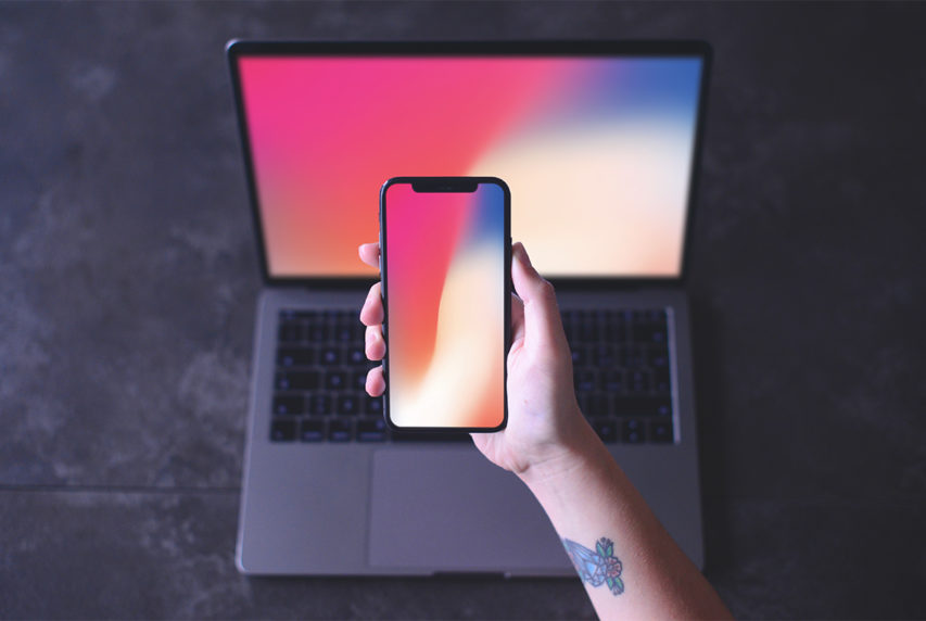 iPhone X in Hand Mockup Free PSD